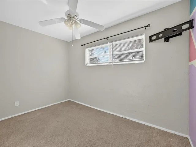 a view of a room with a fan