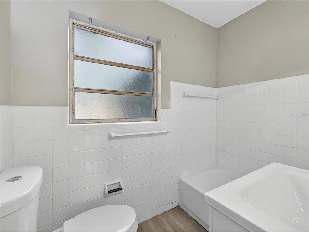 1068 Peter Road Daytona Beach, FL 32114 - Photo 18 of 37 a bathroom with a toilet and a sink