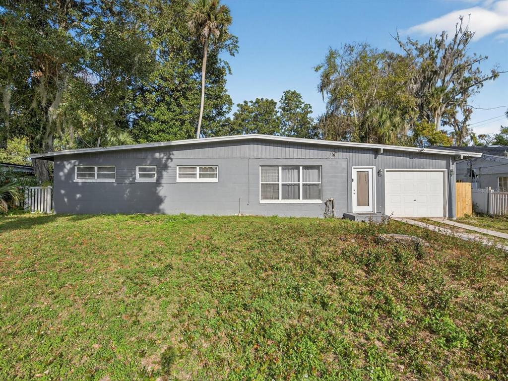 1068 Peter Road Daytona Beach, FL 32114 - Photo 2 of 37 front view of a house with a yard