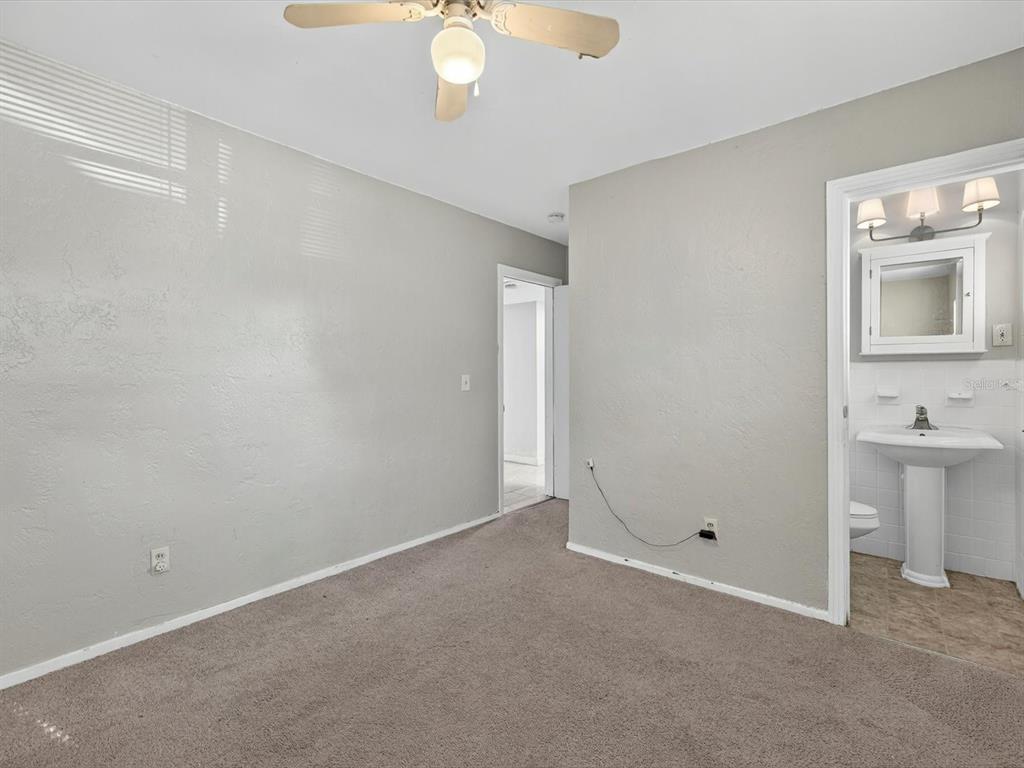 1068 Peter Road Daytona Beach, FL 32114 - Photo 21 of 37 a view of an empty room with window and bathroom