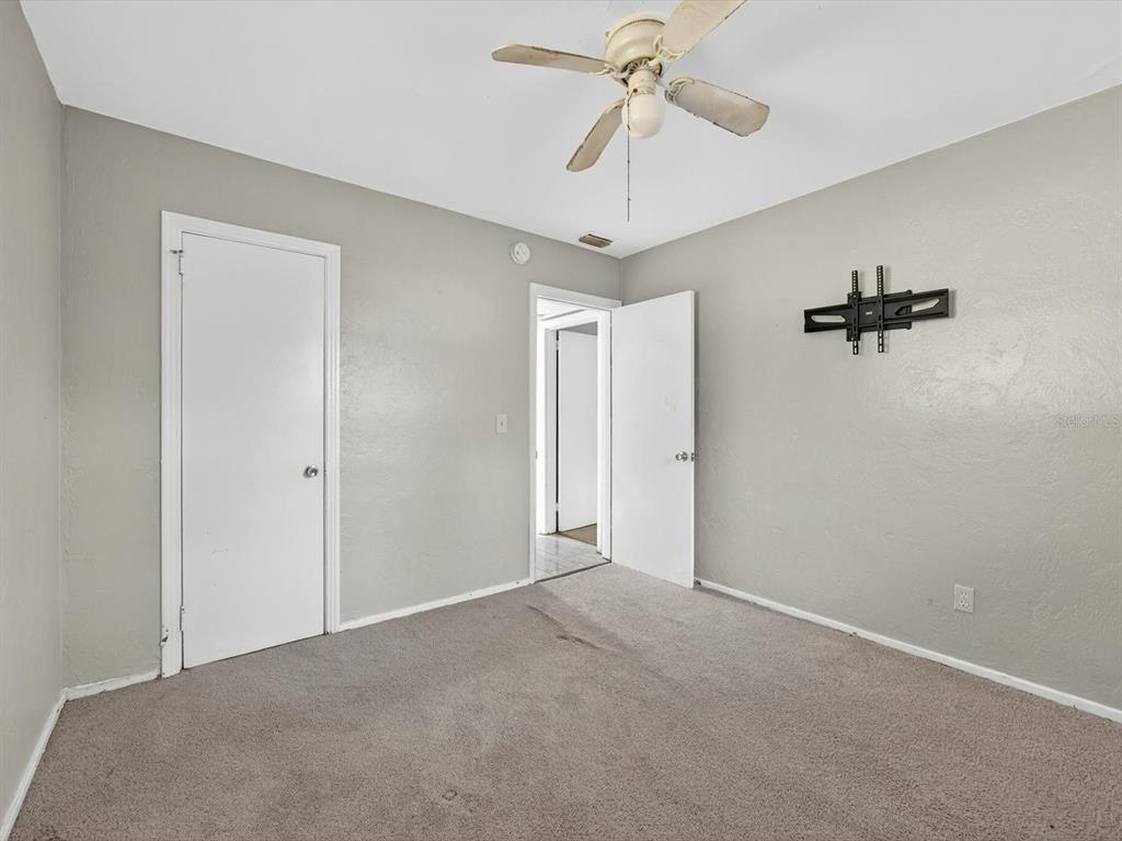 1068 Peter Road Daytona Beach, FL 32114 - Photo 24 of 37 a view of a chandelier fan in a room