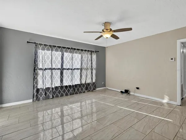 a view of an empty room with a window