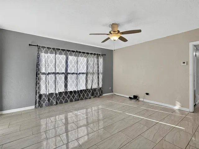 a view of an empty room with a window