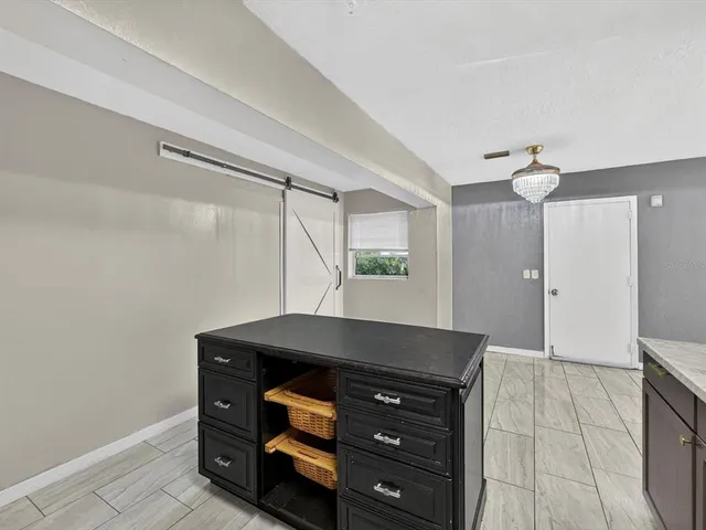 a room with furniture and mirror