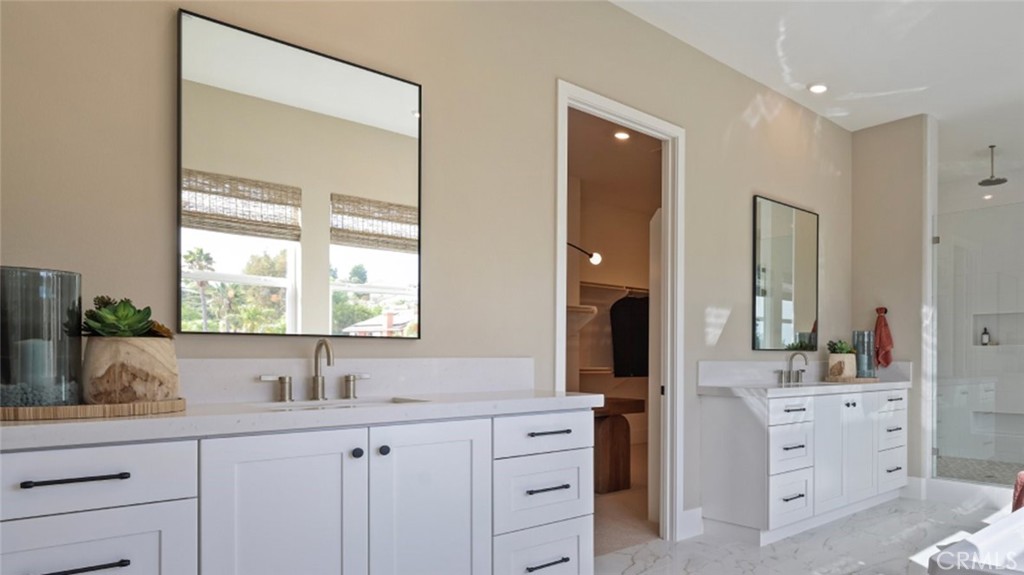 21381 Cloud Ridge Yorba Linda, CA 92887 - Photo 17 of 38 a bathroom with double vanity sink a two mirror a window and a bathtub
