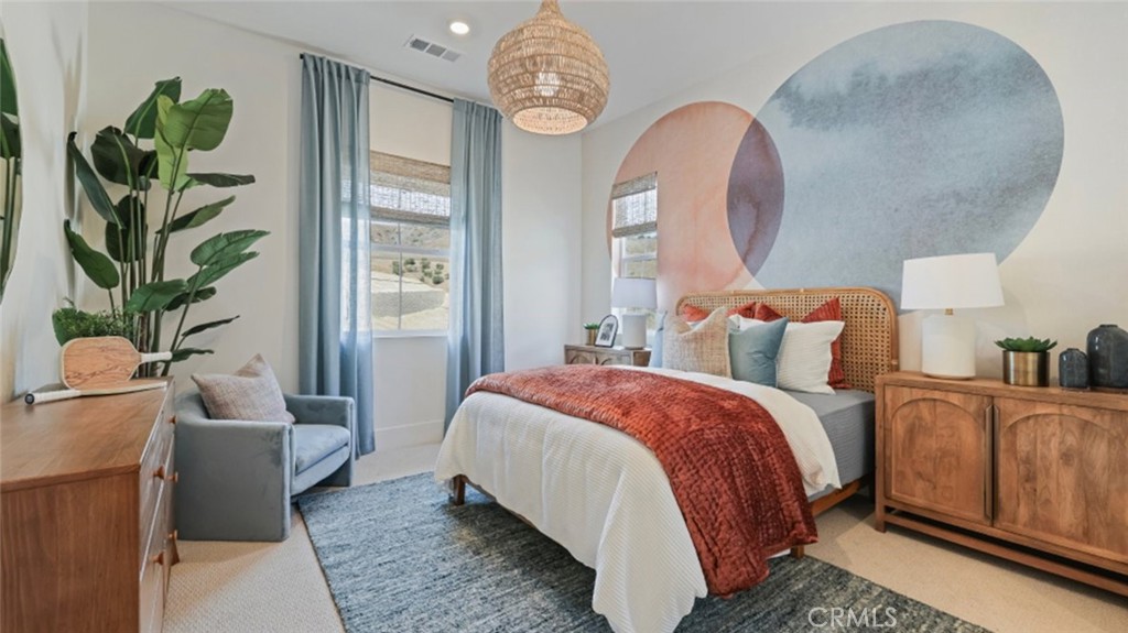 21381 Cloud Ridge Yorba Linda, CA 92887 - Photo 20 of 38 a bedroom with bed and a chandelier