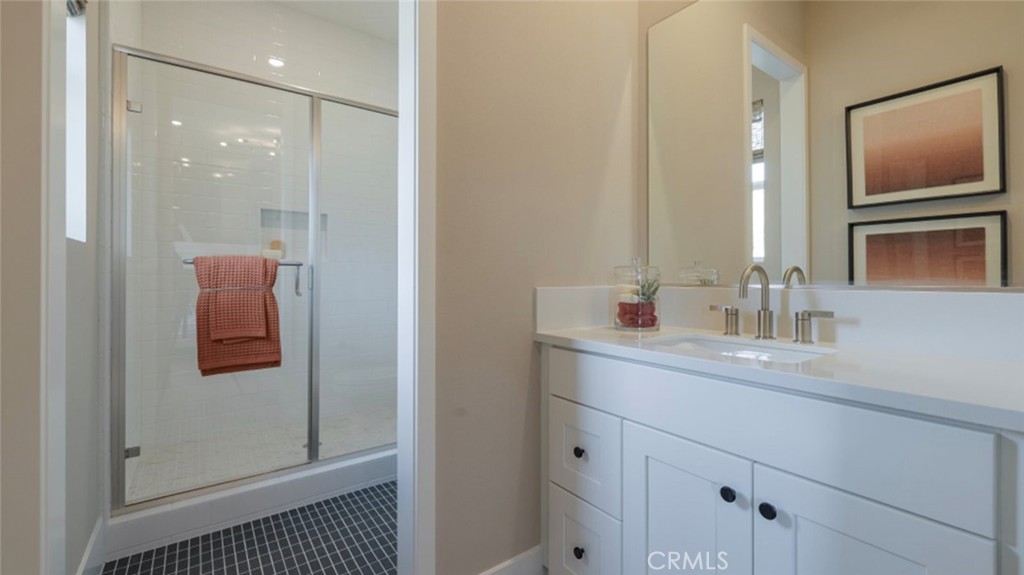 21381 Cloud Ridge Yorba Linda, CA 92887 - Photo 24 of 38 a bathroom with a sink a shower and a mirror