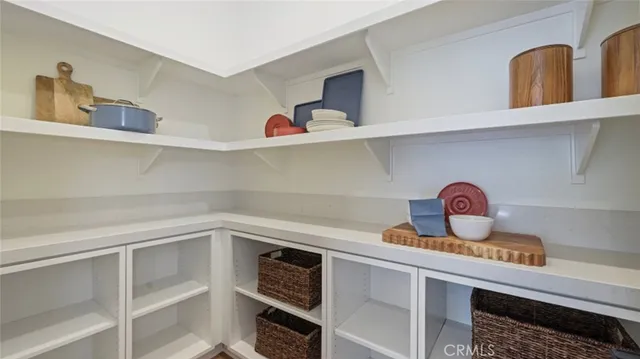 a kitchen with a cabinets and wooden floor