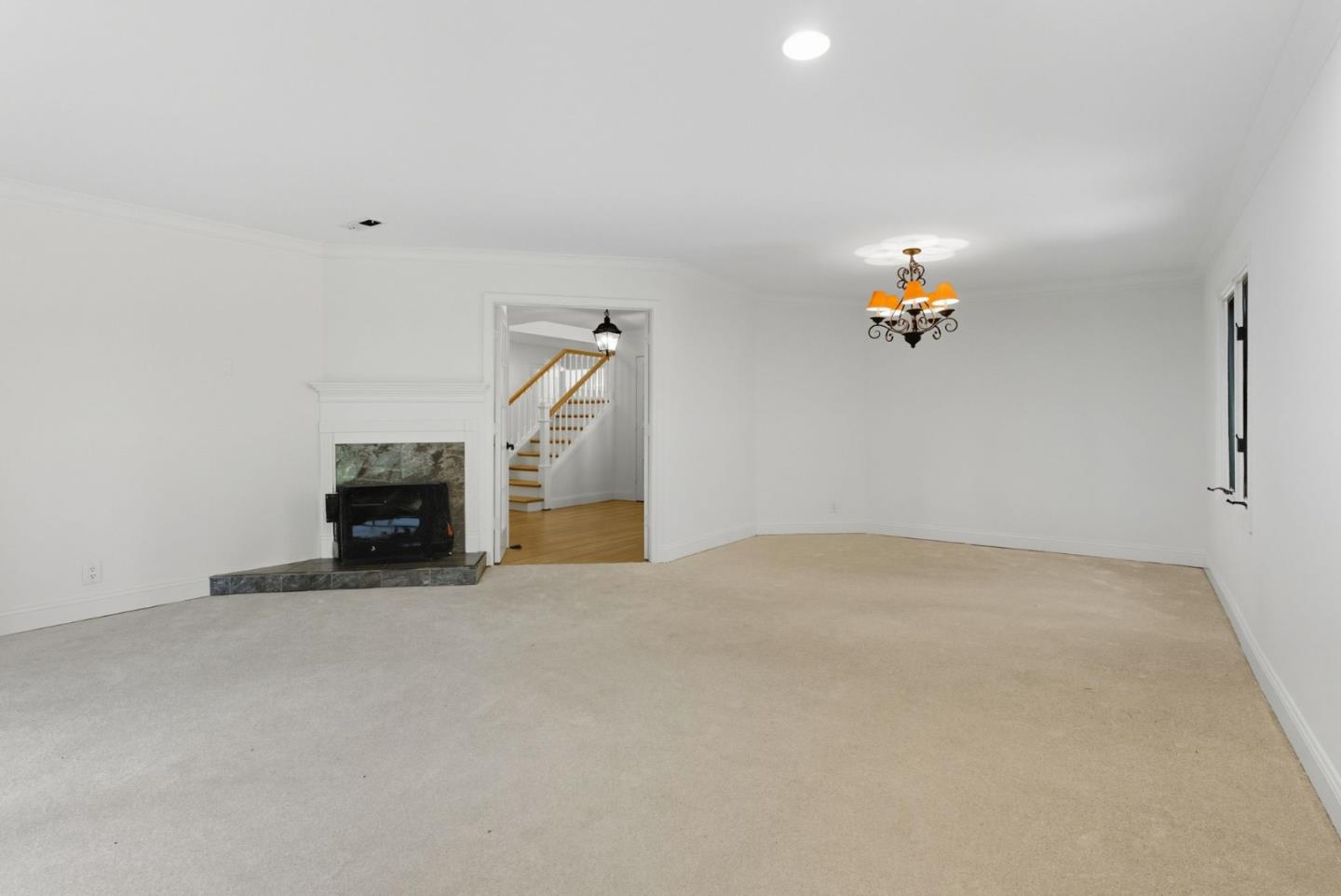 23489 Hutchinson Road Los Gatos, CA 95033 - Photo 13 of 46 a view of empty room with a fireplace