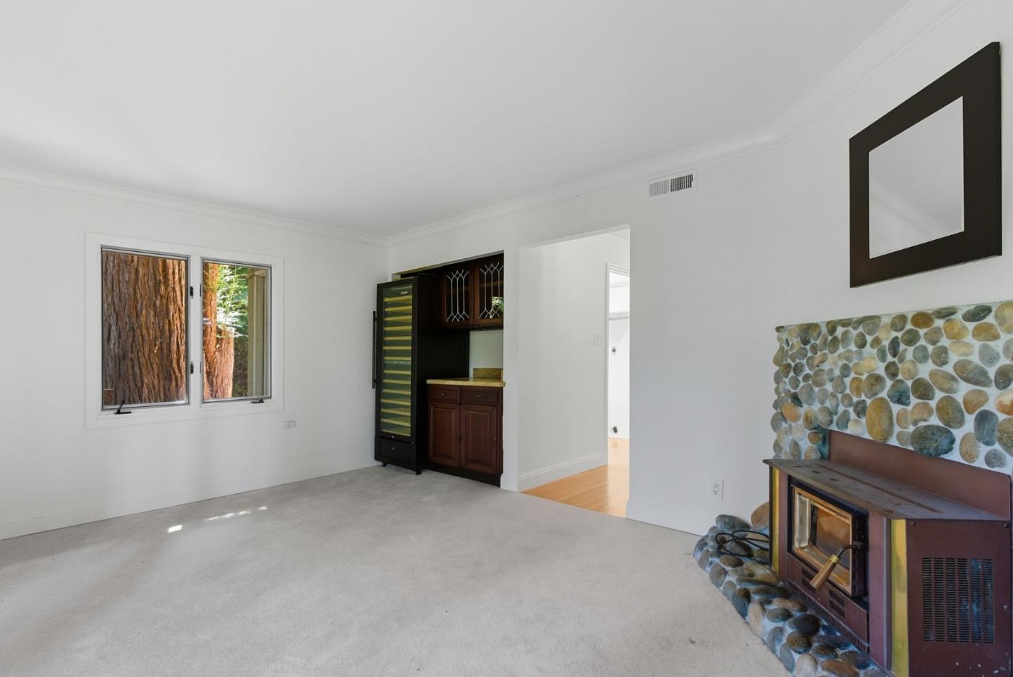 23489 Hutchinson Road Los Gatos, CA 95033 - Photo 17 of 46 a view of an empty room with a window