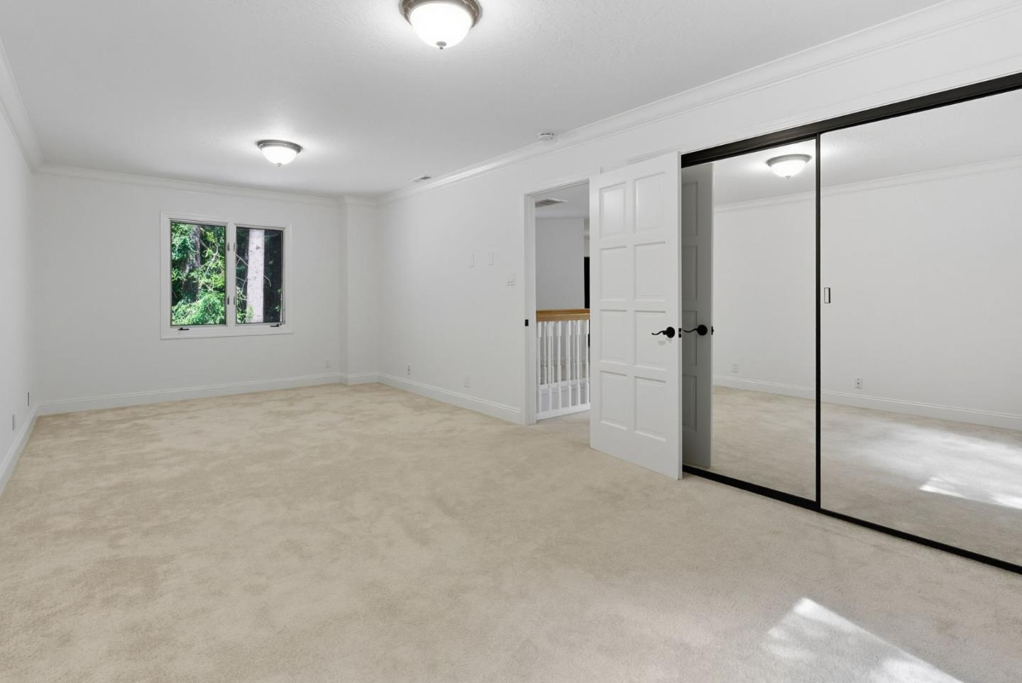 23489 Hutchinson Road Los Gatos, CA 95033 - Photo 20 of 46 an empty room with windows and closet