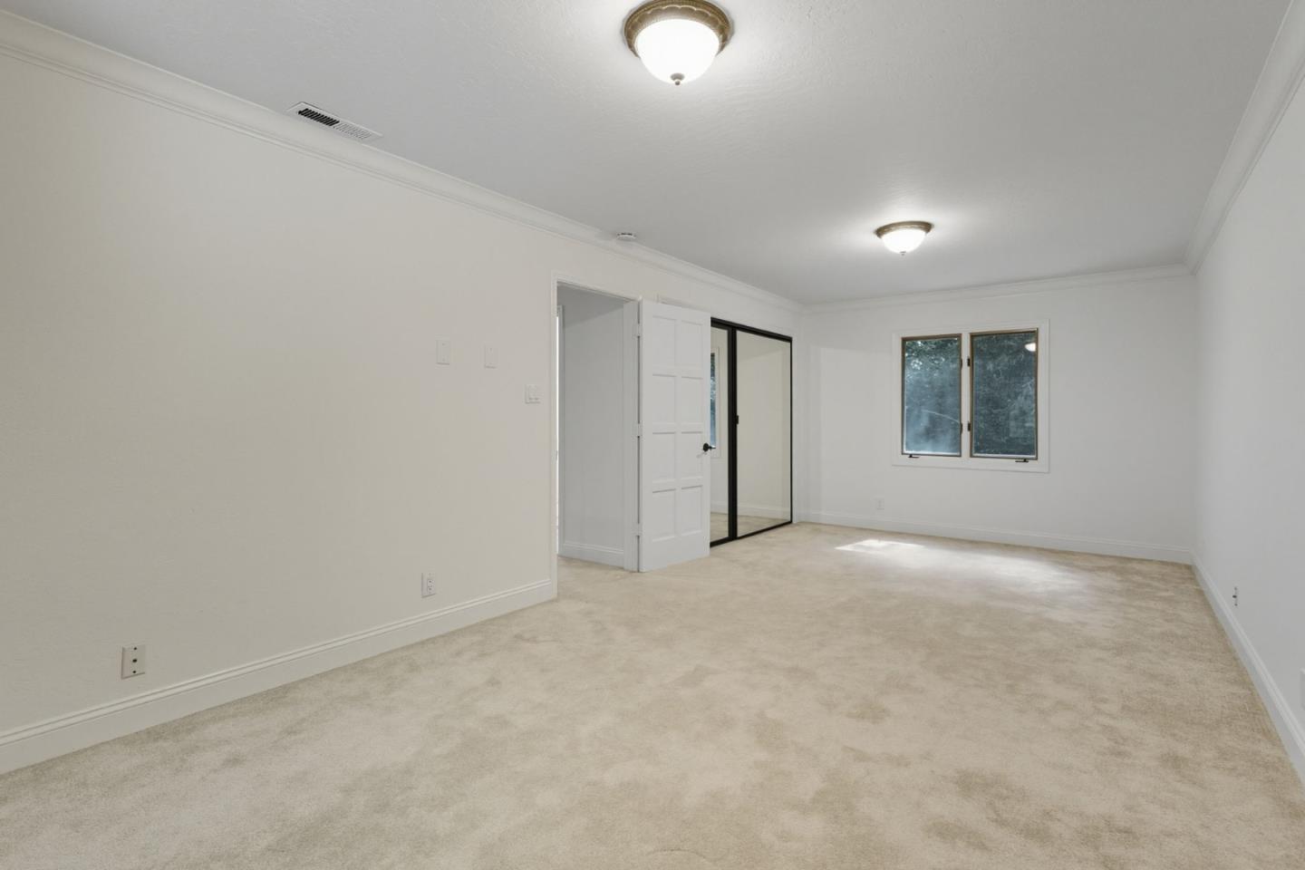 23489 Hutchinson Road Los Gatos, CA 95033 - Photo 21 of 46 a view of an empty room with a window