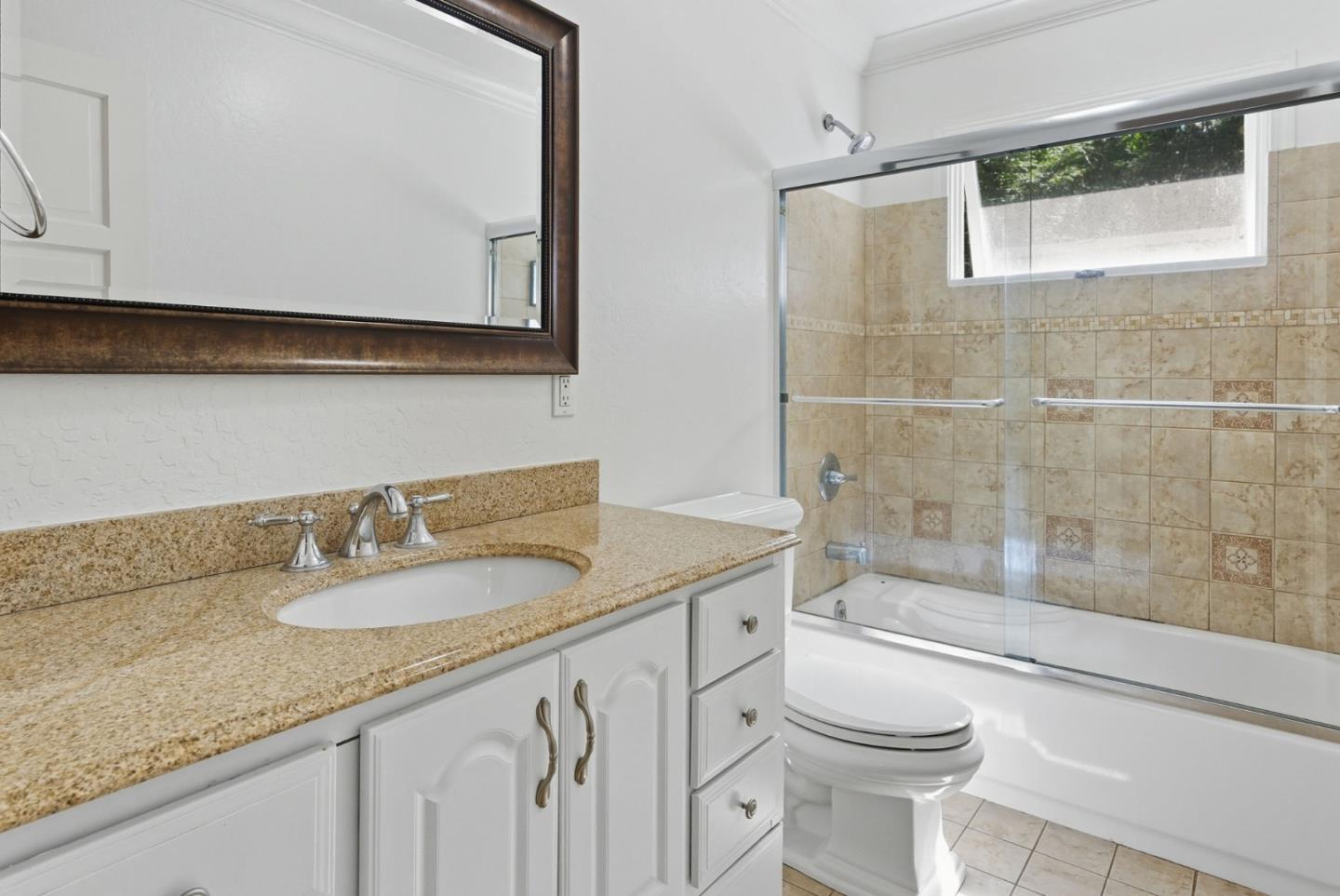 23489 Hutchinson Road Los Gatos, CA 95033 - Photo 26 of 46 a bathroom with a granite countertop sink toilet and shower