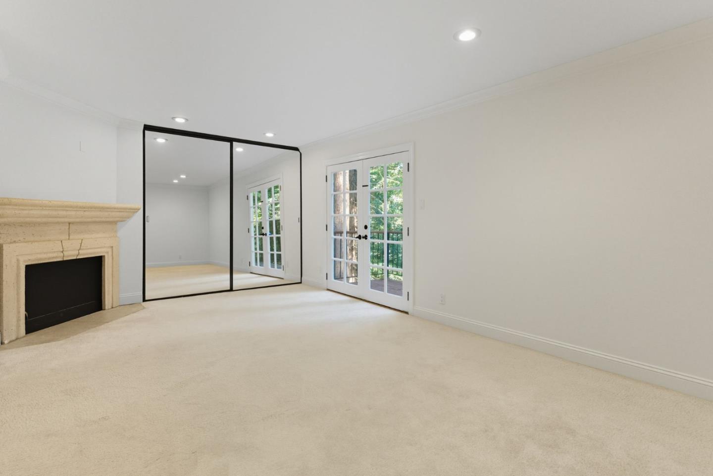 23489 Hutchinson Road Los Gatos, CA 95033 - Photo 29 of 46 an empty room with windows and fireplace