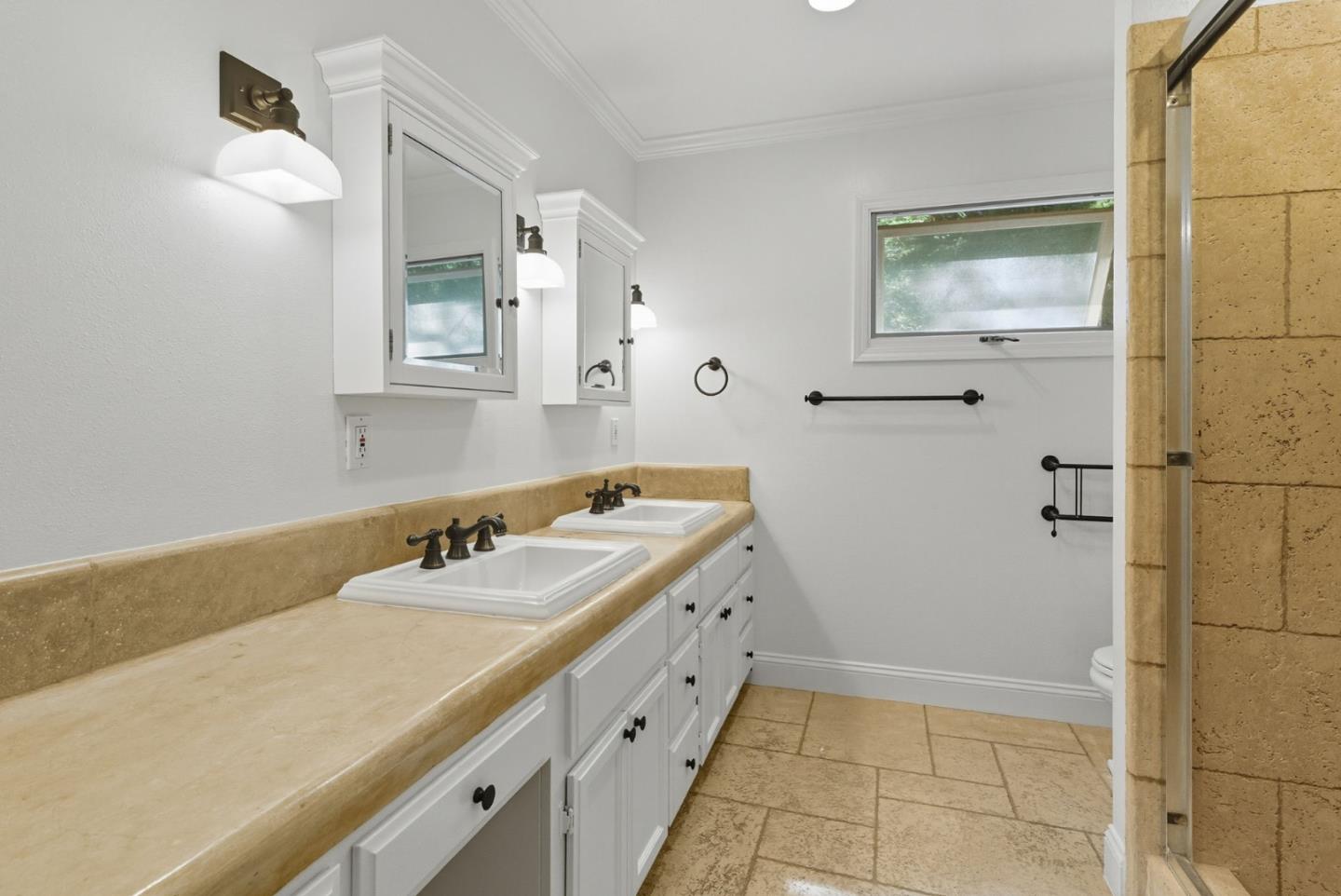 23489 Hutchinson Road Los Gatos, CA 95033 - Photo 30 of 46 a bathroom with a sink a toilet and mirror