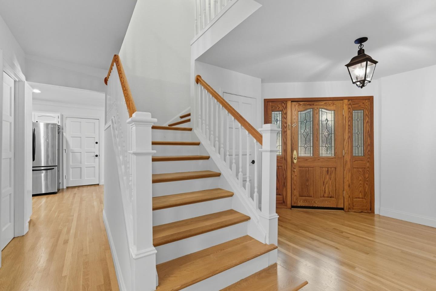23489 Hutchinson Road Los Gatos, CA 95033 - Photo 3 of 46 a view of a hallway with wooden floor and staircase