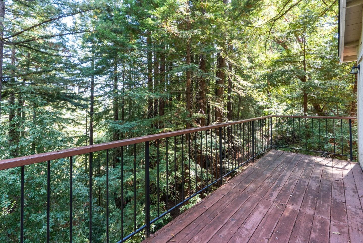 23489 Hutchinson Road Los Gatos, CA 95033 - Photo 31 of 46 a balcony with wooden floor and trees