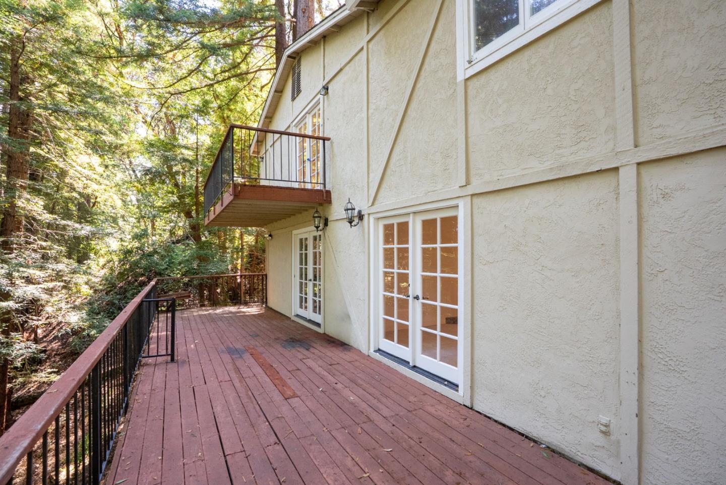 23489 Hutchinson Road Los Gatos, CA 95033 - Photo 36 of 46 a view of balcony with wooden floor and fence and stairs
