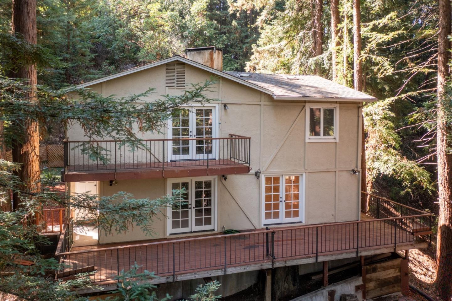 23489 Hutchinson Road Los Gatos, CA 95033 - Photo 40 of 46 a view of a house with a yard