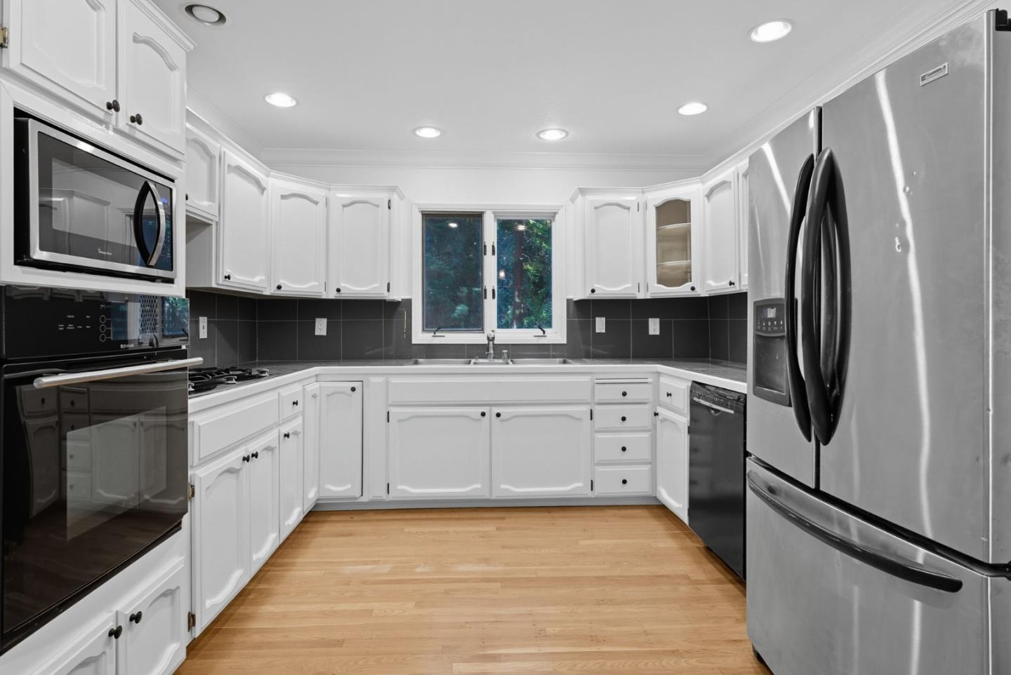 23489 Hutchinson Road Los Gatos, CA 95033 - Photo 5 of 46 a kitchen with stainless steel appliances a refrigerator sink and microwave
