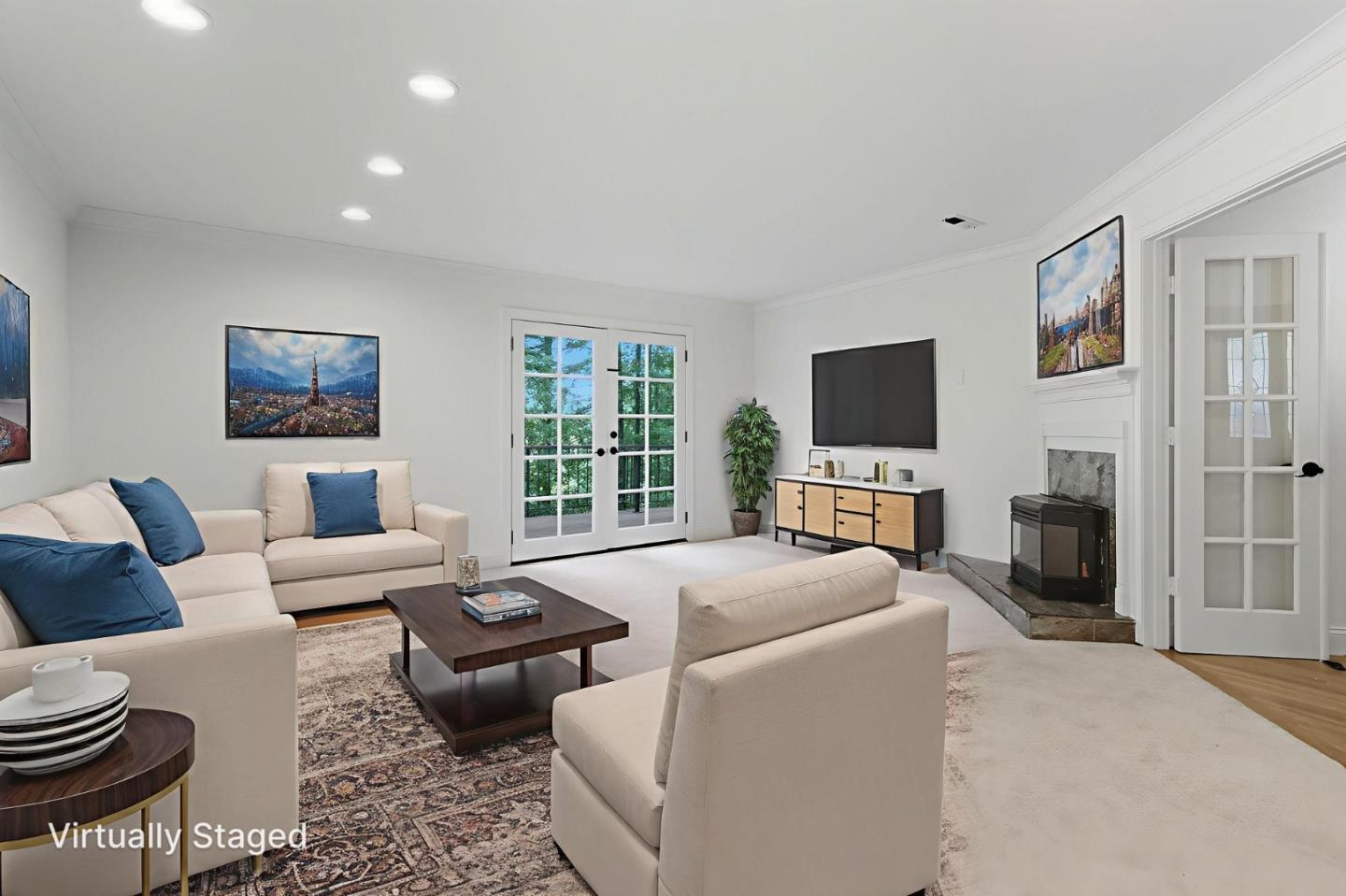 23489 Hutchinson Road Los Gatos, CA 95033 - Photo 10 of 46 a living room with furniture a flat screen tv and a fireplace