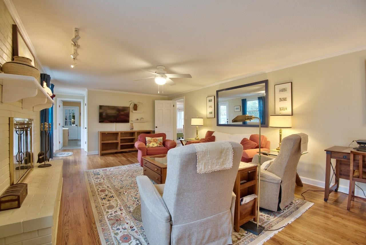 3563 Hamstead Court Durham, NC 27707 - Photo 11 of 37 a living room with furniture flat screen tv and couches