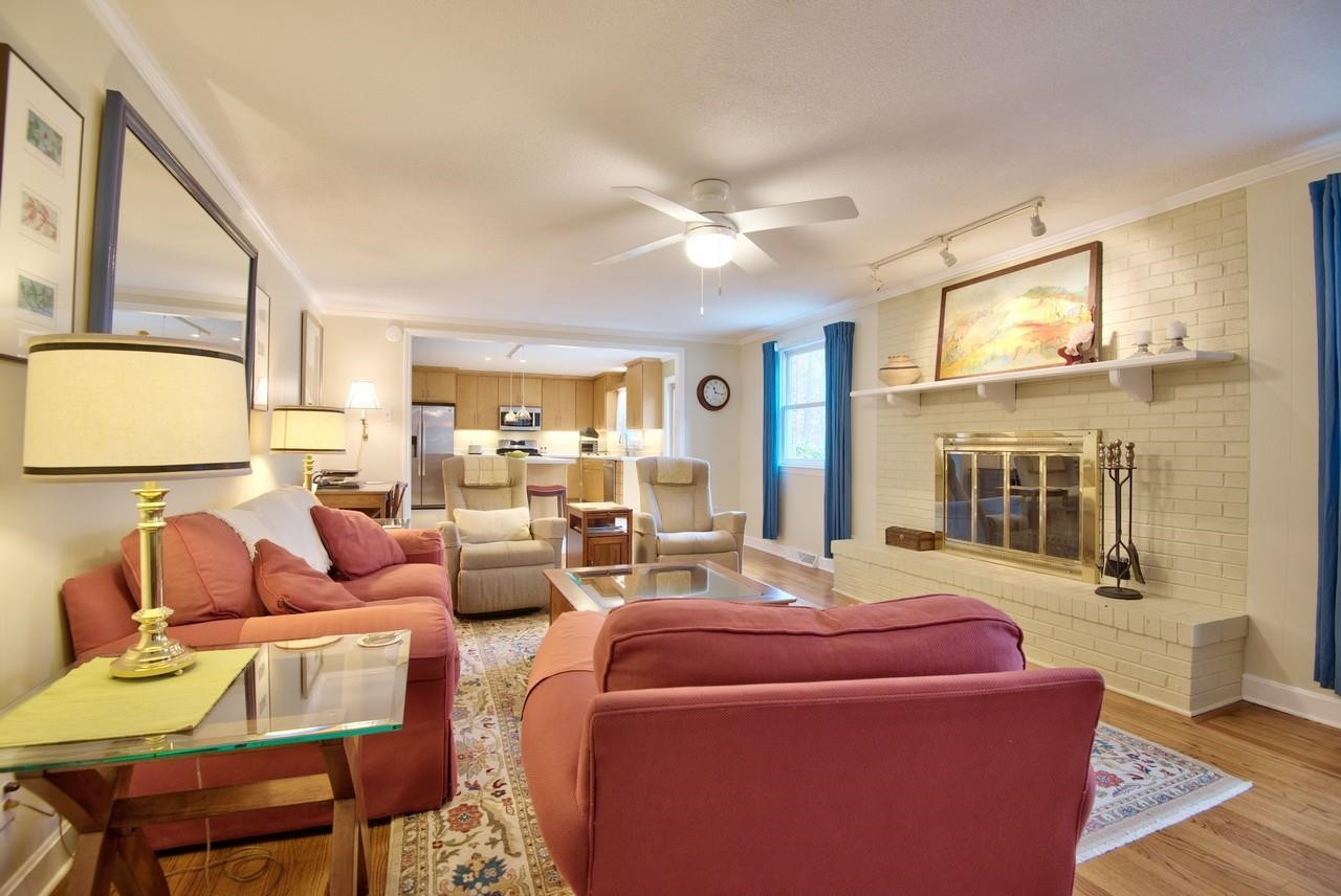 3563 Hamstead Court Durham, NC 27707 - Photo 12 of 37 a living room with furniture fireplace and a large window
