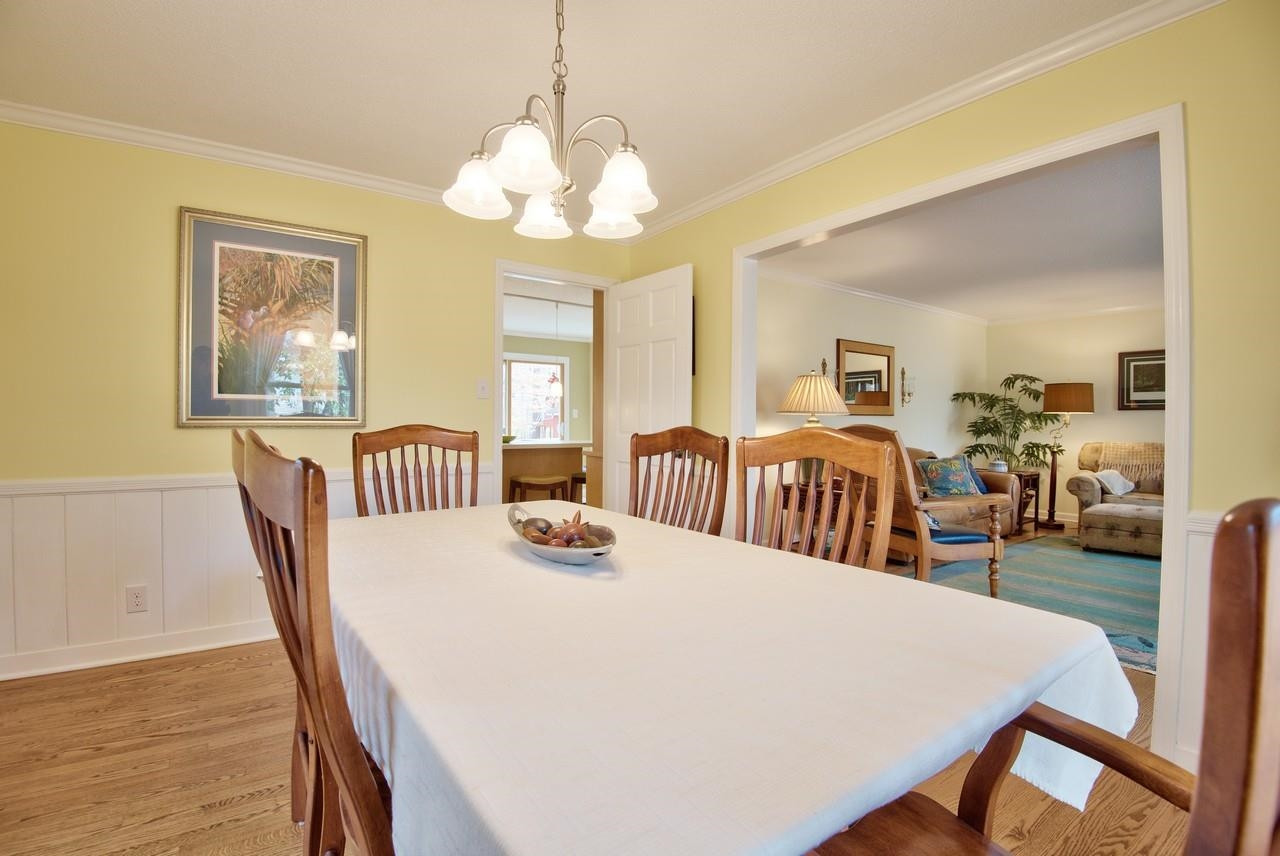 3563 Hamstead Court Durham, NC 27707 - Photo 16 of 37 a view of a dining room with furniture window and wooden floor