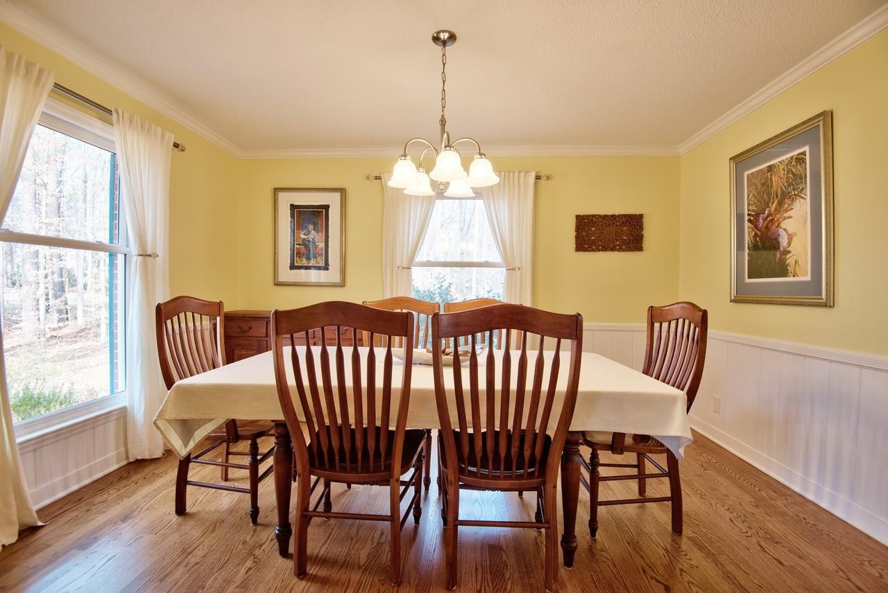 3563 Hamstead Court Durham, NC 27707 - Photo 17 of 37 a view of a dining room with furniture window and wooden floor