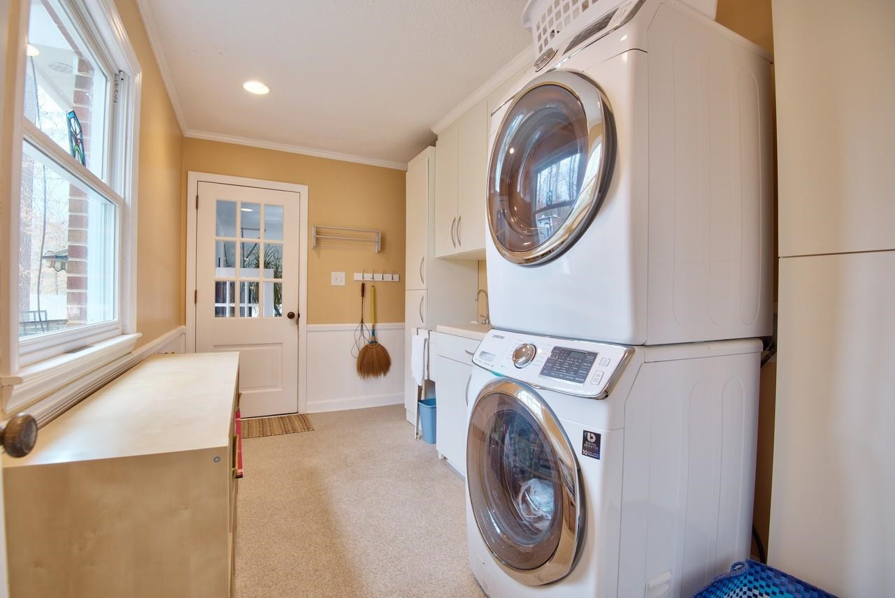 3563 Hamstead Court Durham, NC 27707 - Photo 24 of 37 a view of a bedroom with washer and dryer