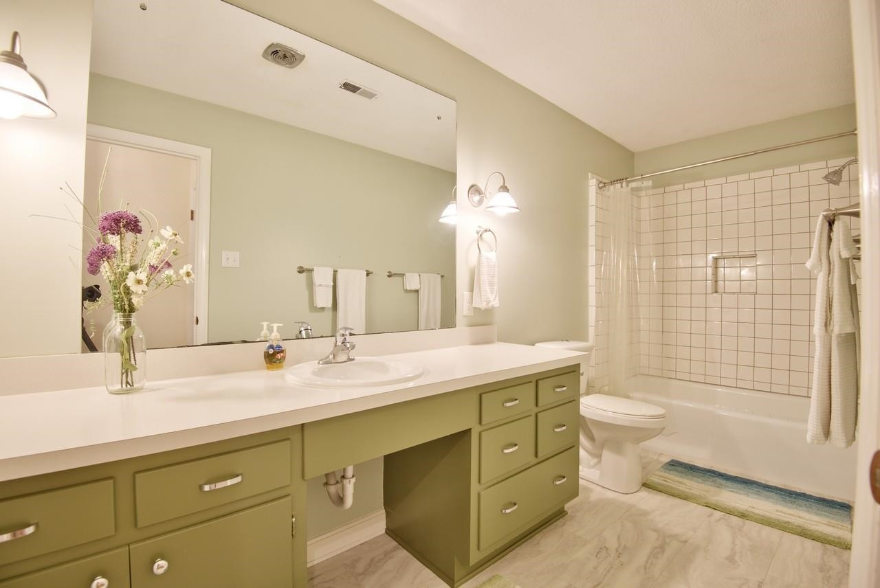 3563 Hamstead Court Durham, NC 27707 - Photo 27 of 37 a bathroom with a double vanity sink toilet and shower