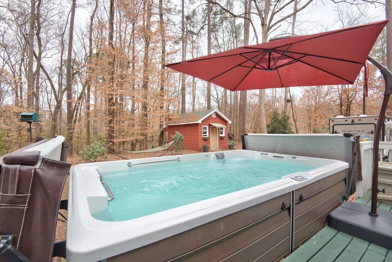 3563 Hamstead Court Durham, NC 27707 - Photo 32 of 37 a view of a backyard with sitting area