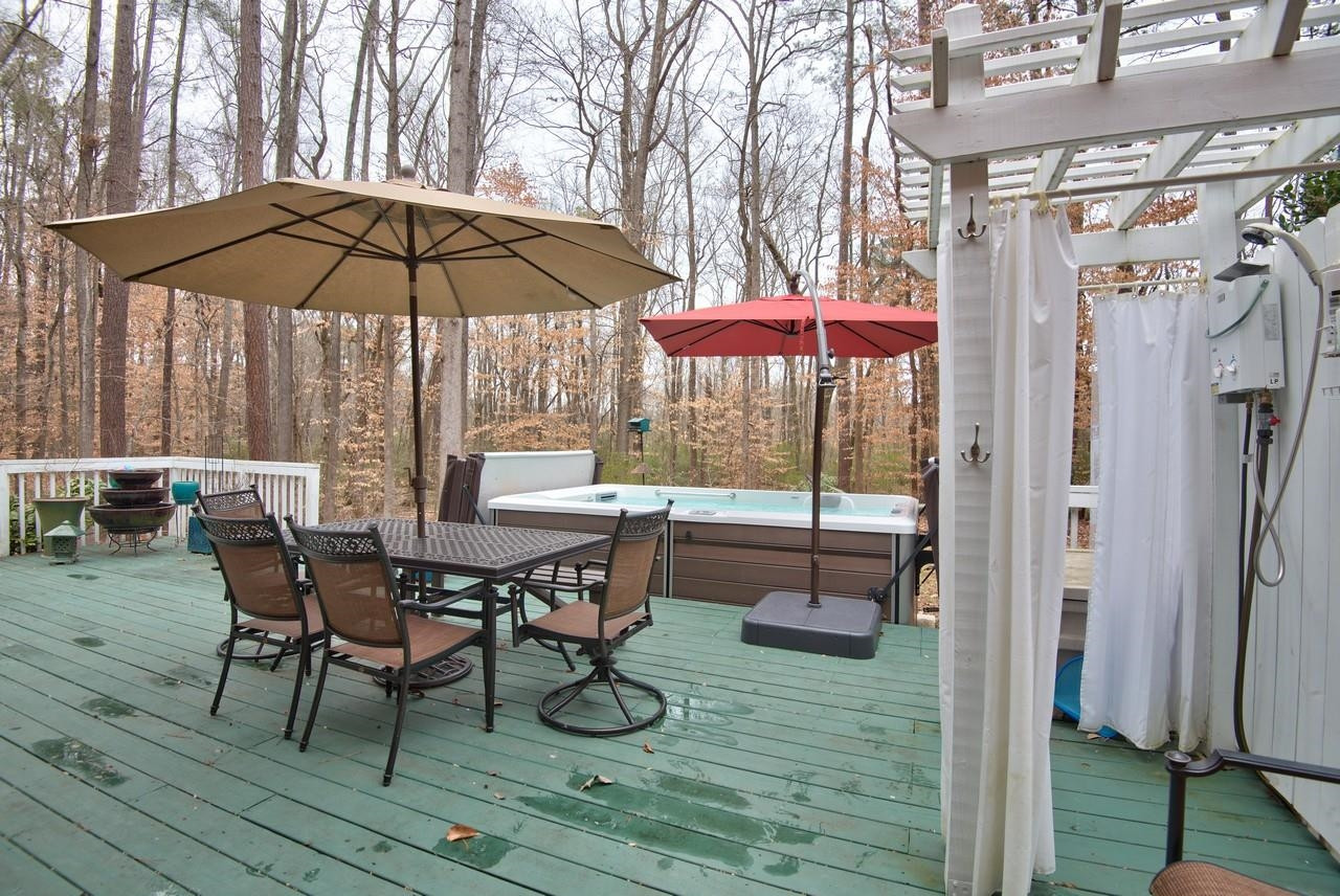 3563 Hamstead Court Durham, NC 27707 - Photo 33 of 37 a view of a dinning table and chairs in the patio