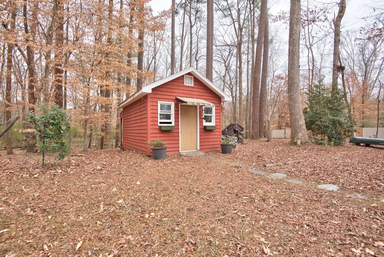 3563 Hamstead Court Durham, NC 27707 - Photo 35 of 37 a backyard of a house with table and chairs