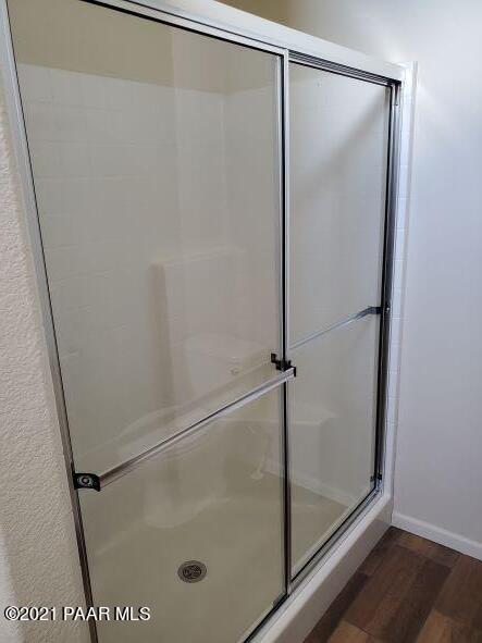 425 West Antelope Run Road Paulden, AZ 86334 - Photo 13 of 16 a bathroom with a glass shower door