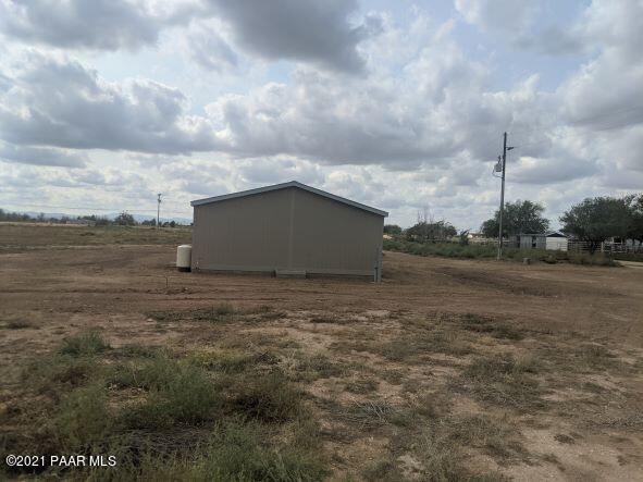 425 West Antelope Run Road Paulden, AZ 86334 - Photo 3 of 16 a view of a dry yard with wooden fence