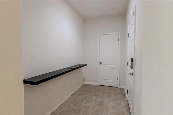 a view of a hallway with stairs