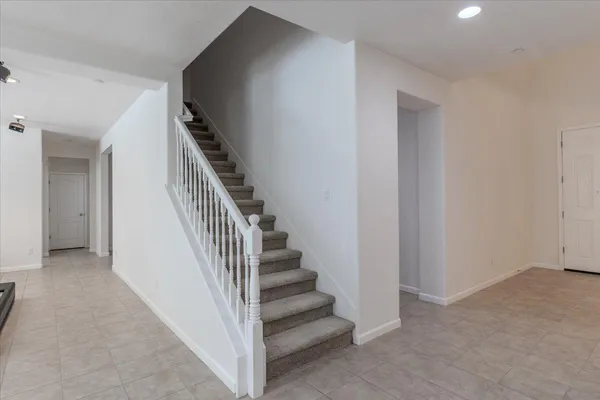 a view of a hallway with staircase