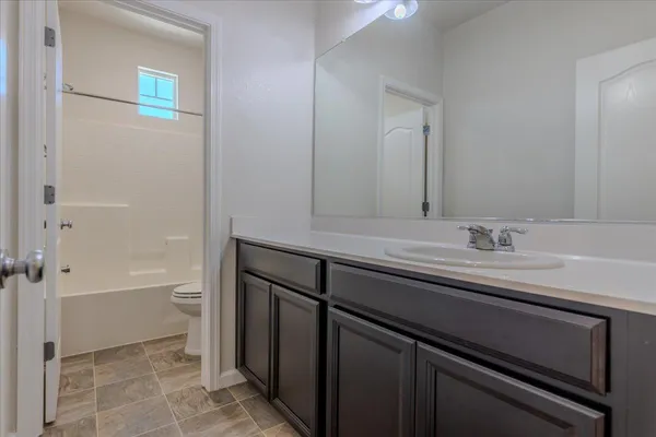 a bathroom with a sink a toilet and a bathtub