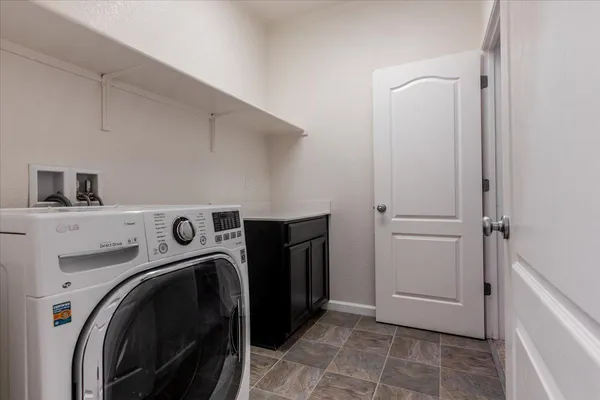 a view of a storage & utility room with washer and dryer