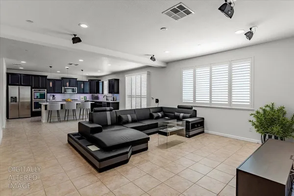a living room with furniture and a potted plant