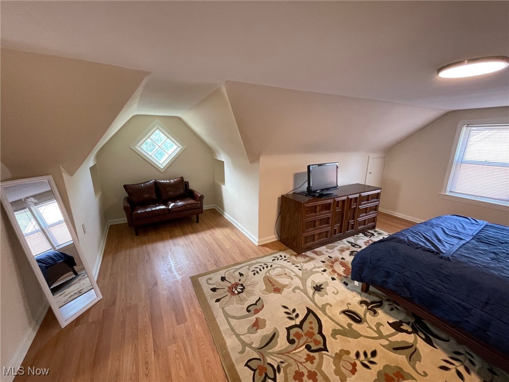 1539 Winchester Road Lyndhurst, OH 44124 - Photo 13 of 21 Bedroom featuring vaulted ceiling and light hardwood / wood-style flooring