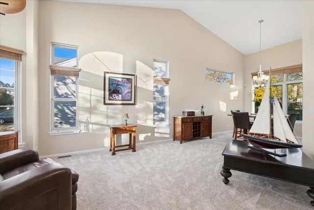 a living room with furniture gym equipment and a flat screen tv