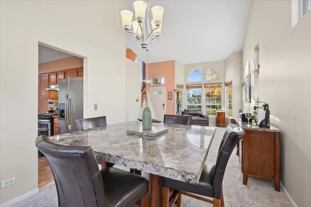 a view of a dining room with furniture window and outside view