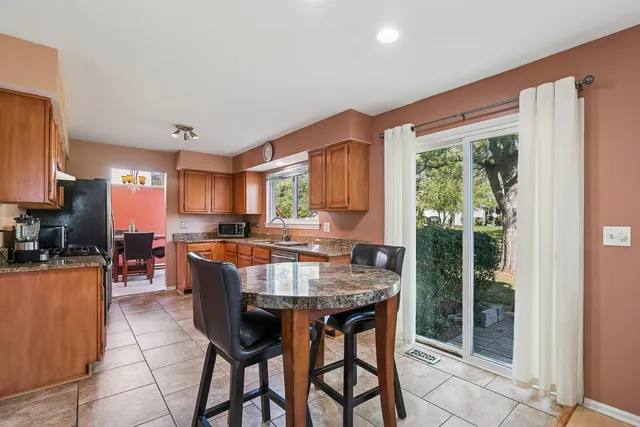 a view of a dining room with furniture window and outside view
