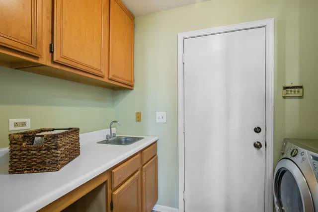 a kitchen with stainless steel appliances granite countertop a sink and a cabinets