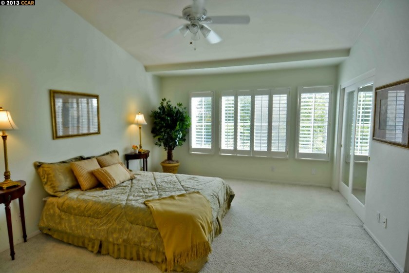 112 Coralflower Lane San Ramon, CA 94582 - Photo 11 of 21 a bed sitting in a bedroom next to a window
