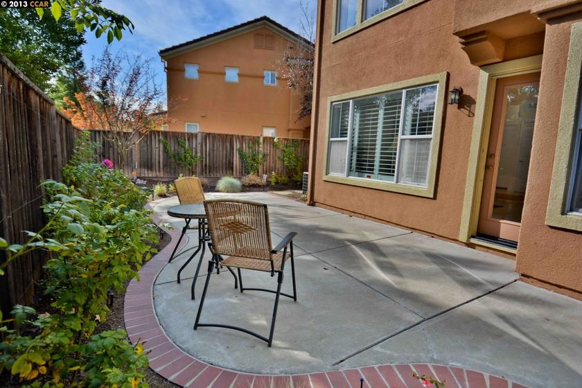 112 Coralflower Lane San Ramon, CA 94582 - Photo 20 of 21 a view of a backyard with table and chairs potted plants and wooden fence