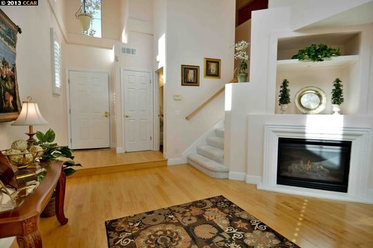 112 Coralflower Lane San Ramon, CA 94582 - Photo 3 of 21 a living room with furniture and a fireplace