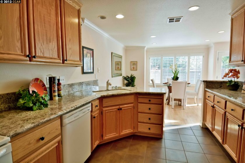 112 Coralflower Lane San Ramon, CA 94582 - Photo 9 of 21 a kitchen with stainless steel appliances granite countertop a sink and cabinets